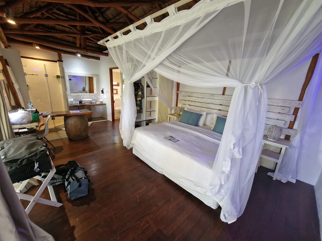 Insecticide-treated bed net over a bed